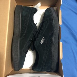 Black suede pumas